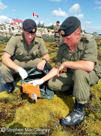 Soldiers search for debris